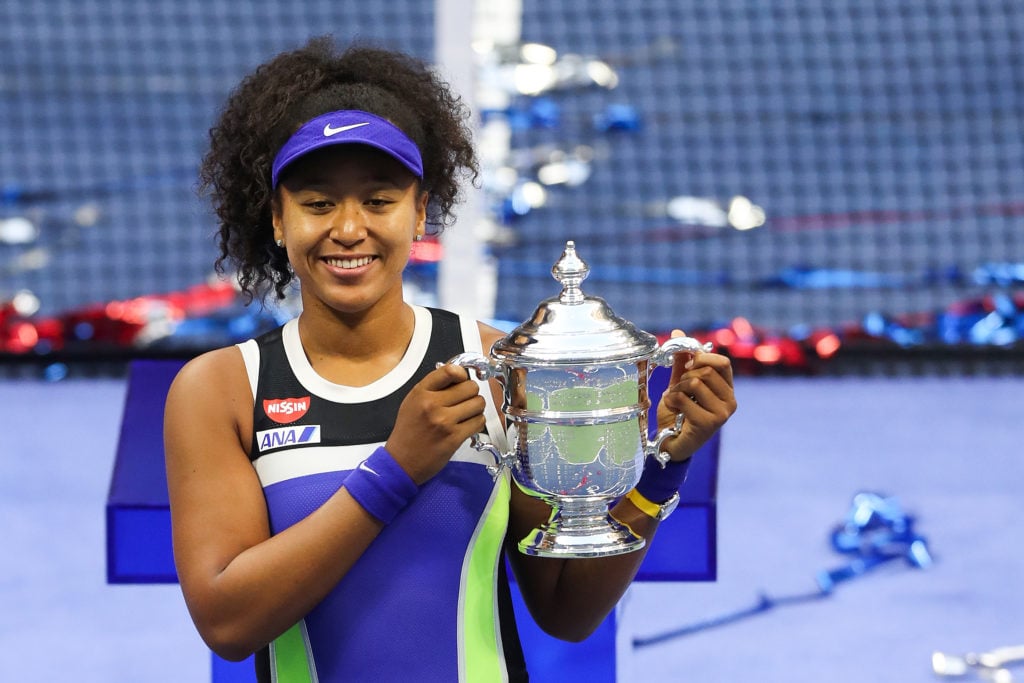 Naomi Osaka poses with the 2020 US Open title after beating Victoria Azarenka