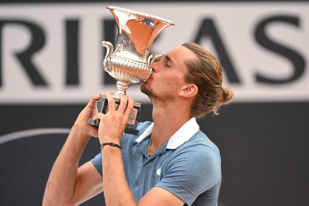 Alexander Zverev of Germany kisses the trophy at the end of