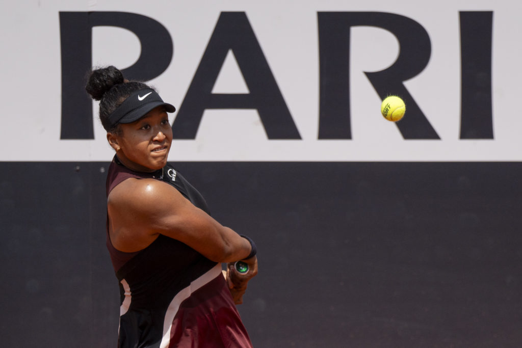 Naomi Osaka of Japan in action against Qinwen Zheng of China