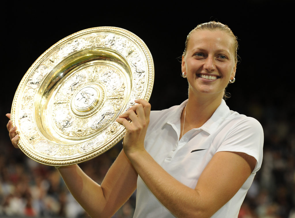 Petra Kvitova celebrates with the trophy after winning Wimbledon for the second time in 2014