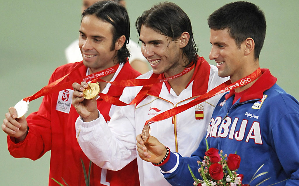 Silver medallist Fernando Gonzalez (L) o