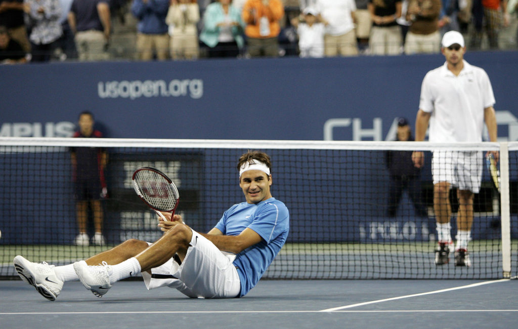 Number one seeded Roger Federer (L) of S