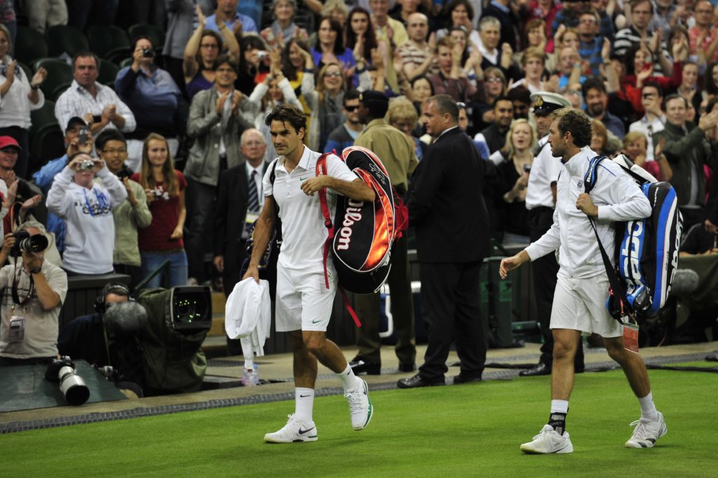 Switzerland's Roger Federer (L) and Fran