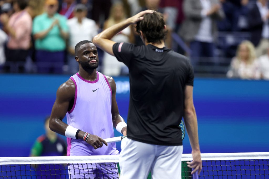 Frances Tiafoe and Taylor Fritz walk to the net after their 2024 US Open semifinal match
