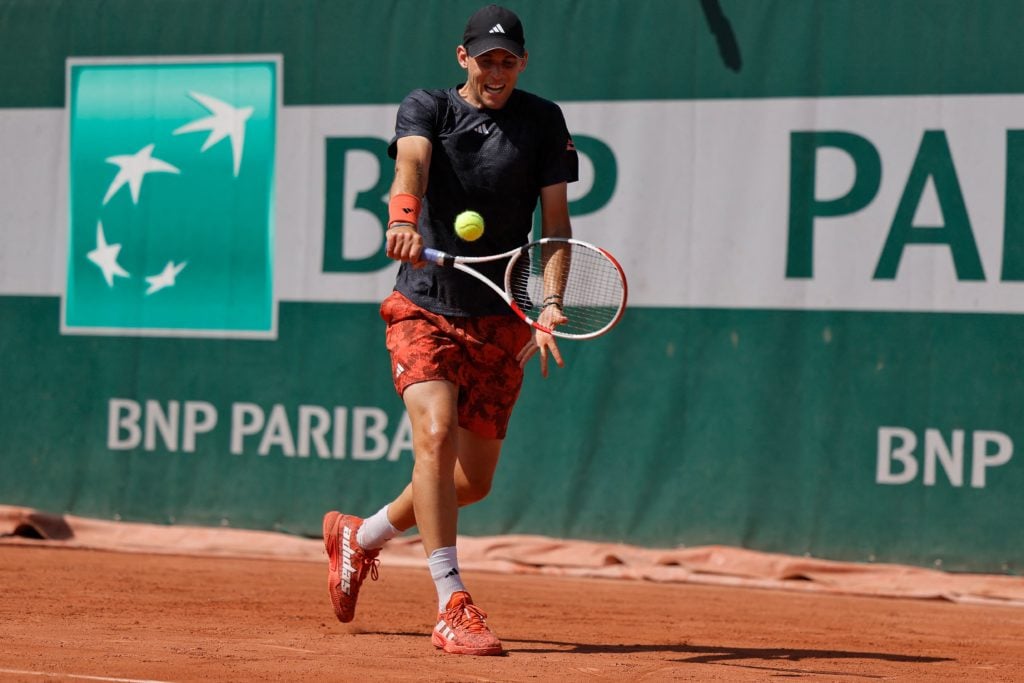 Dominic Thiem hitting a backhand.