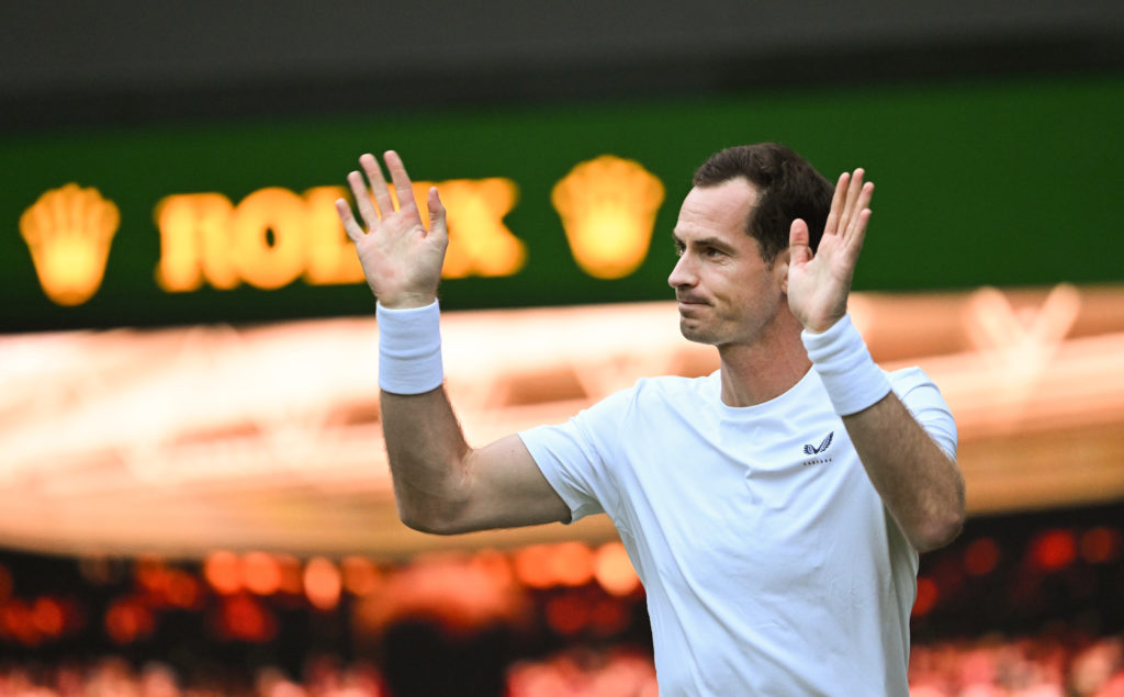 Andy Murray waves to the crowd at Wimbledon in 2024.