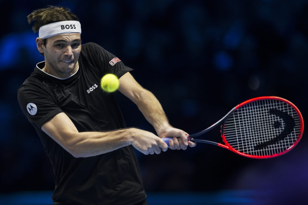 Taylor Fritz of USA plays a backhand during his final
