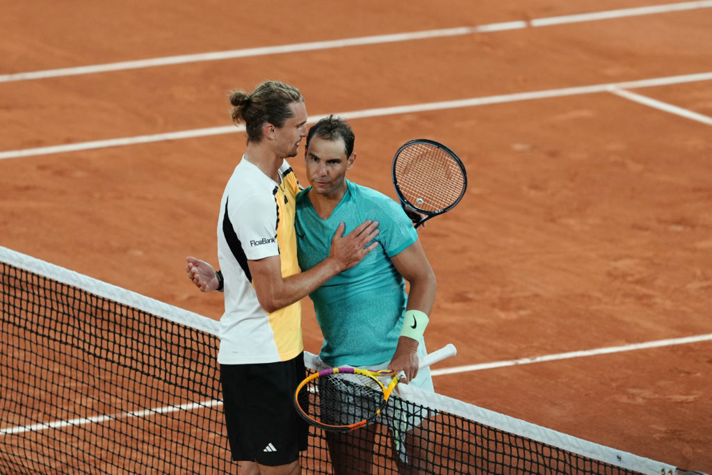 Alexander Zverev and Rafael Nadal embrace.