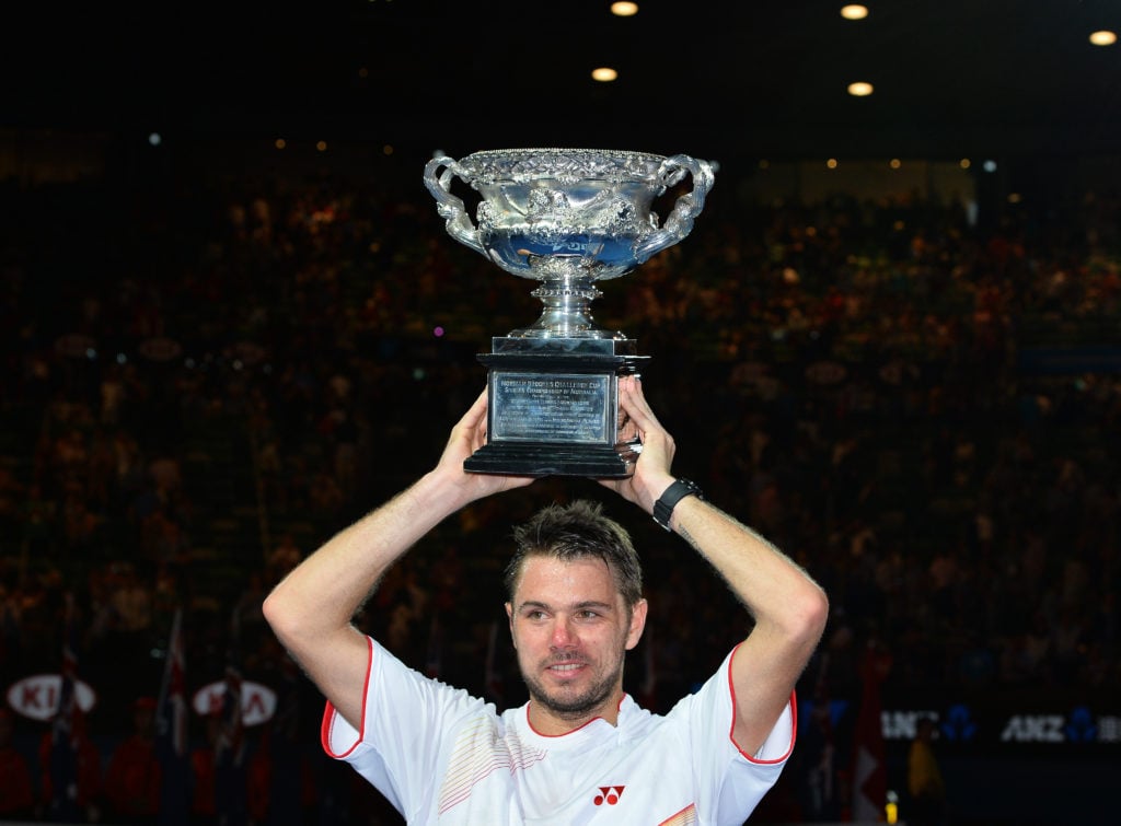 Stan Wawrinka holds the 2014 Australian Open title aloft.