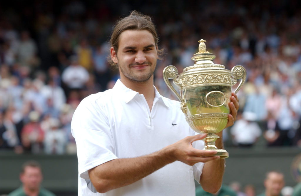 Roger Federer holds the trophy after winning the 2003 Wimbledon Mens Singles Final