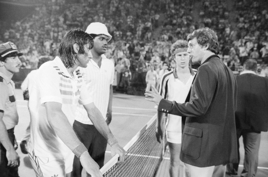 Official Giving Ilie Nastase a Warning