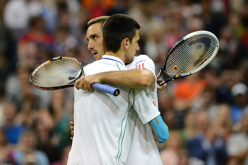 Serbia's Novak Djokovic (L) embraces Ser