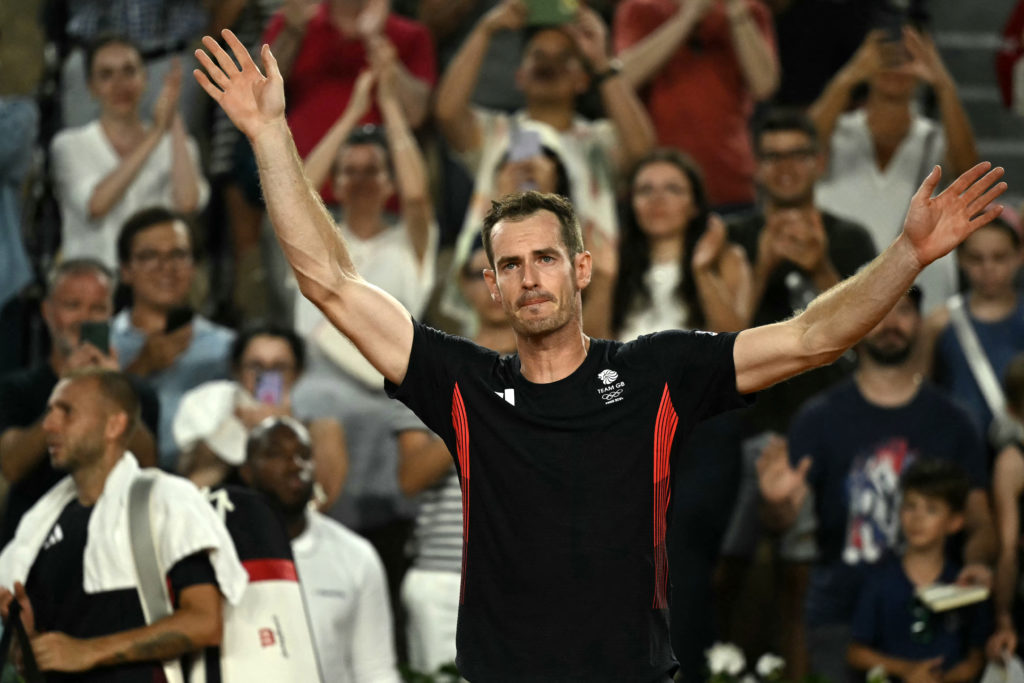 Andy Murray waves goodbye to the crowd after playing his final game at the 2024 Olympic Games