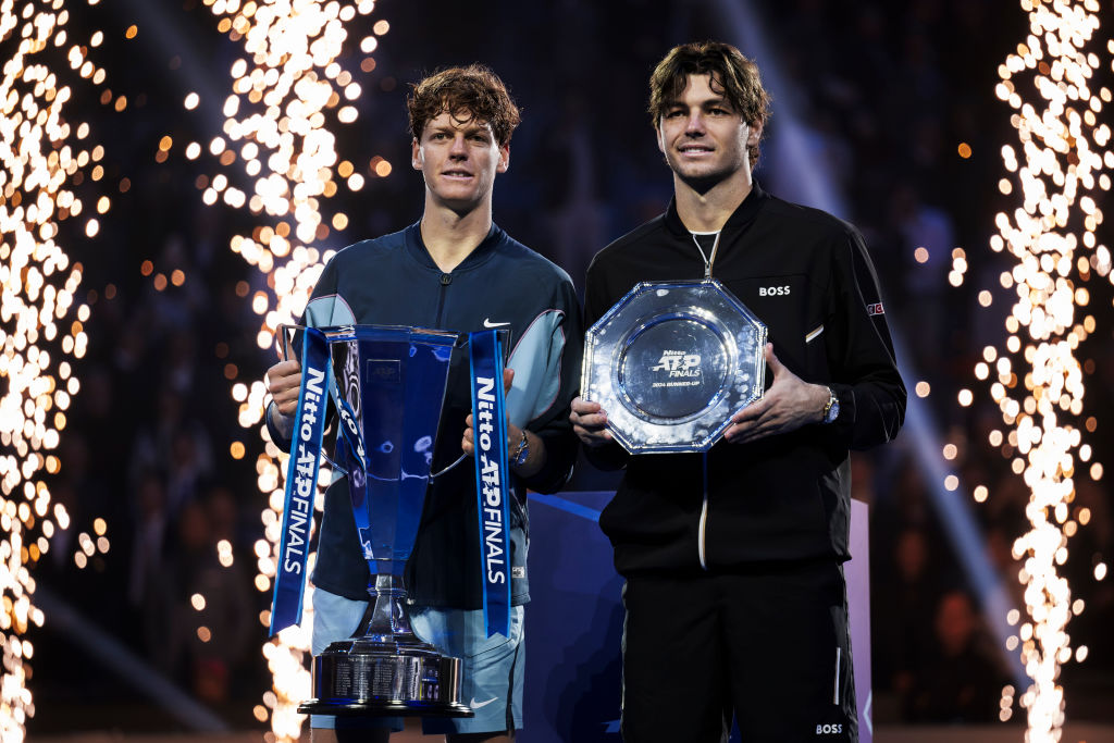 Jannik Sinner (L) of Italy and Taylor Fritz of USA pose with