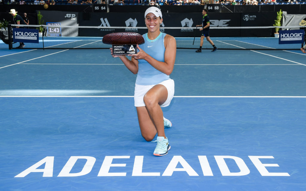 Madison Keys holds the Adelaide International trophy after beating Jessica Pegula in the 2025 final.