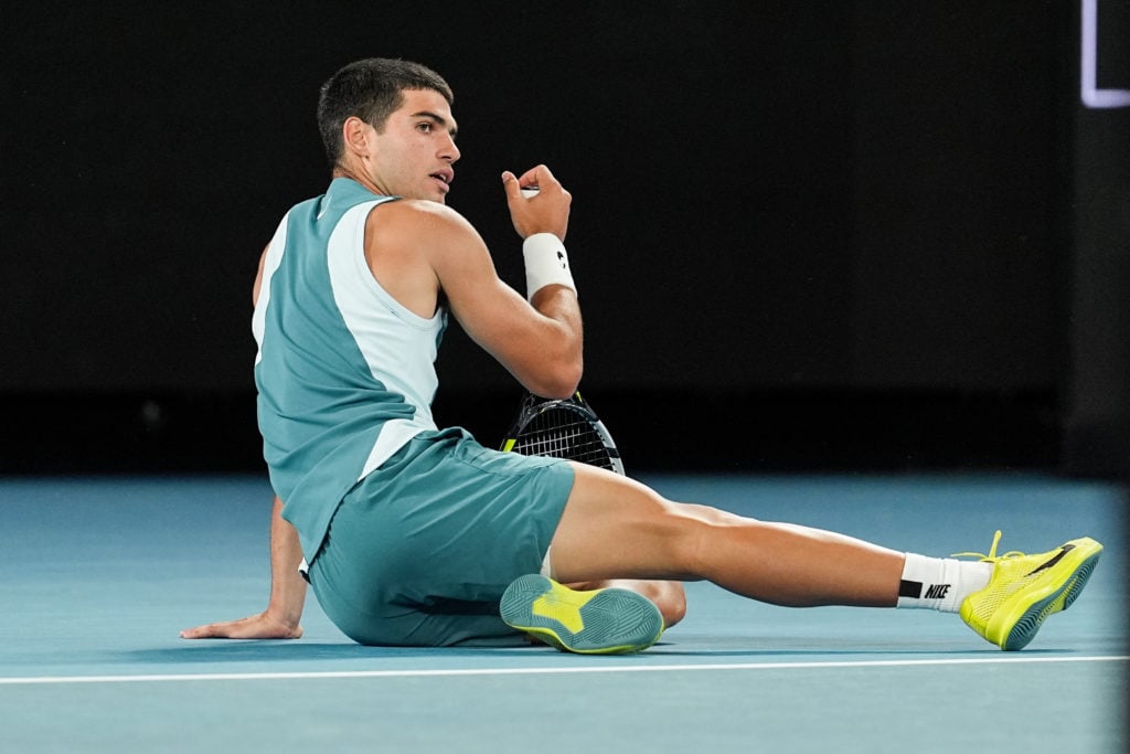 Carlos Alcaraz on the floor during the 2025 Australian Open