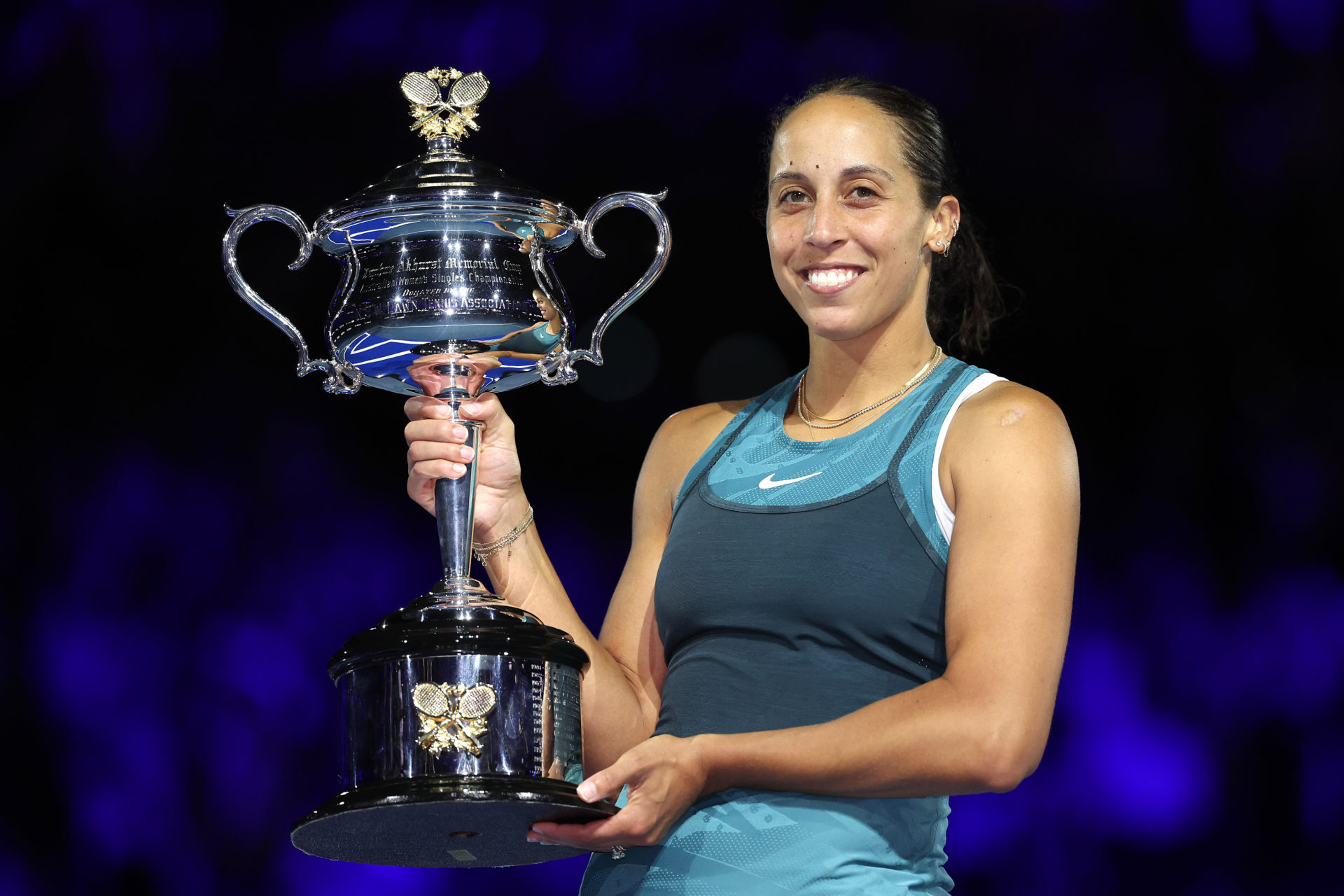 Madison Keys poses with the Australian Open trophy after beating Aryna Sabalenka in the 2025 final