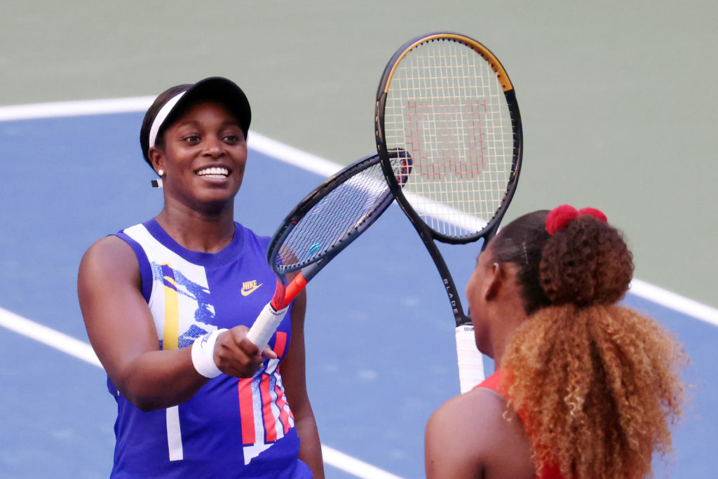 Sloan Stephens and Serena Williams touch rackets at the net 2020 US Open - Day 6