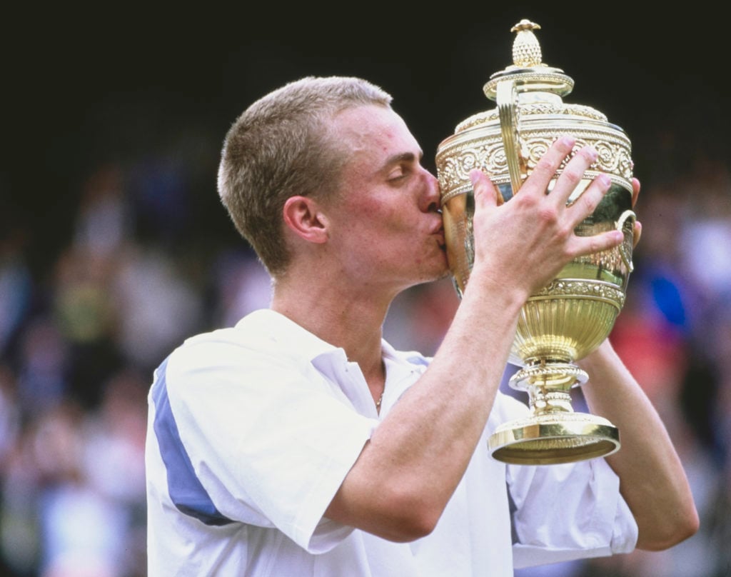Lleyton Hewitt kisses the Wimbledon trophy after winning the title in 2002