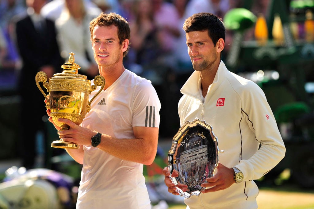 Novak Djokovic and Andy Murray pose with their trophies after the 2013 Wimbledon final