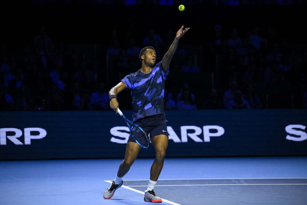 Giovanni Mpetshi Perricard serves against Ben Shelton at the Swiss Indoors in 2024.