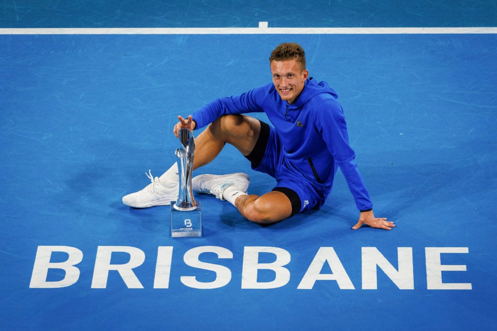 Jiri Lehecka poses with the Brisbane International title after beating Reilly Opelka in the 2025 final