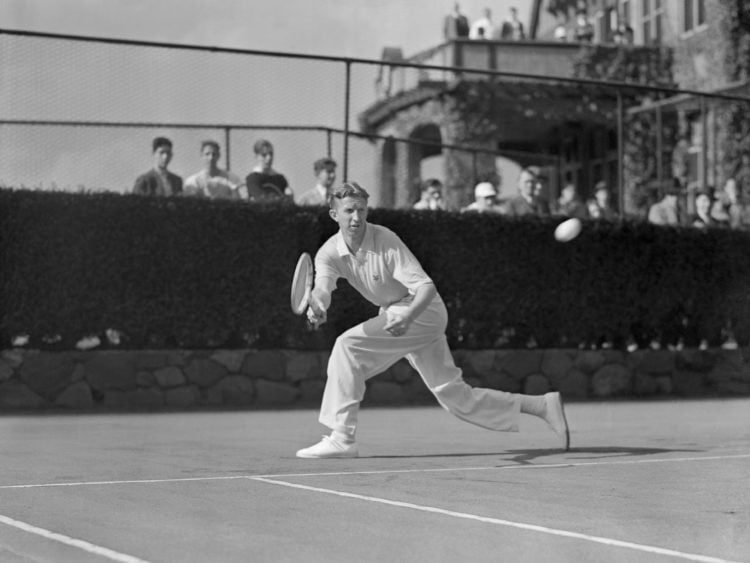 (Original Caption) Don Budge, of California, world's amateur tennis champion, is shown during a warm-up round at the west side tennis club as part ...