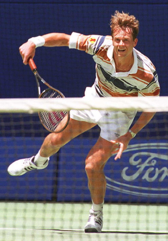 Sweden's Stefan Edberg follows his serve towards t
