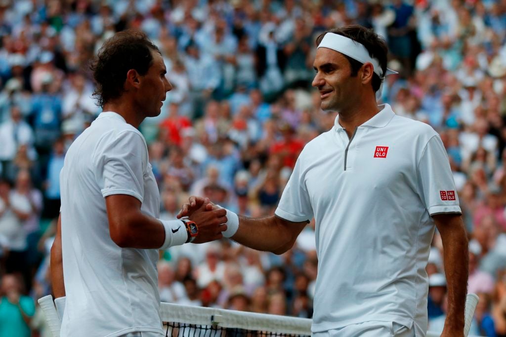 Roger Federer and Rafael Nadal shake hands.