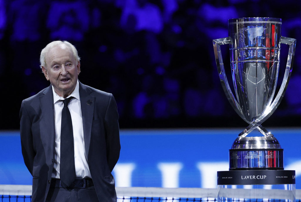 Rod Laver stands with the Laver Cup trophy.