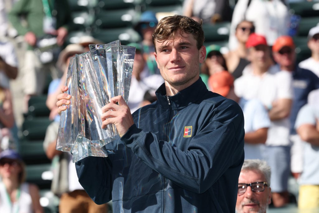 Jack Draper poses with the Indian Wells trophy after beating Holger Rune in the 2025 final.