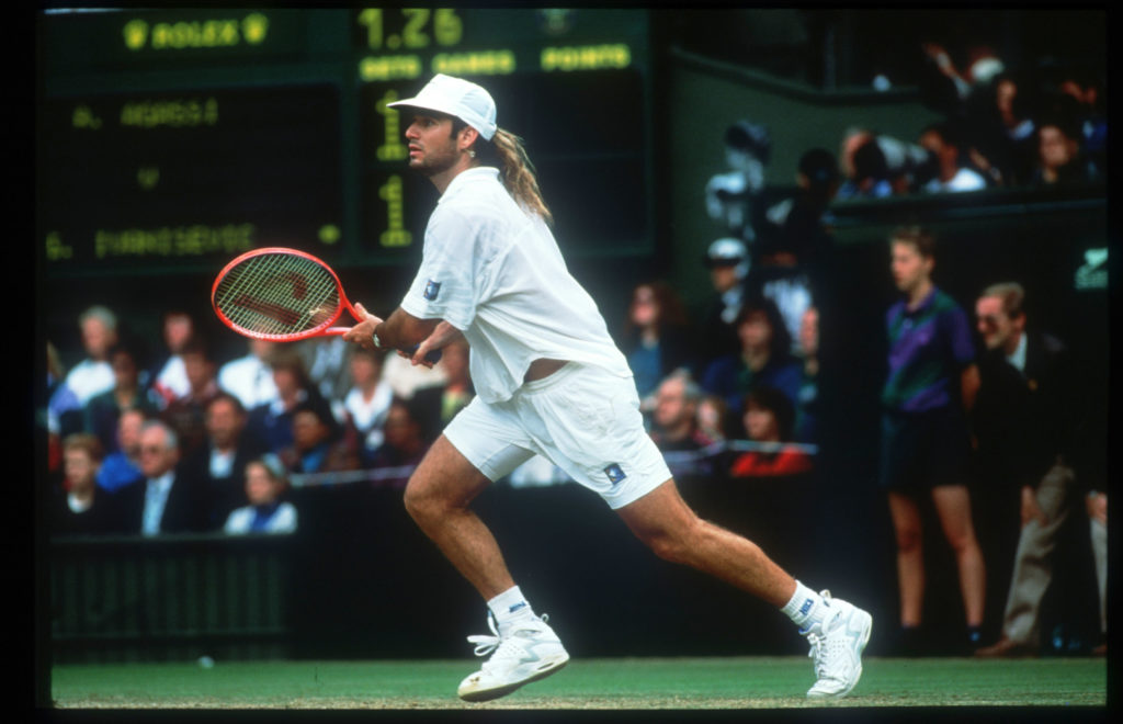 Tennis Player Andre Agassi Returns A Serve During The Wimbledon Tournament July 5 1992 I