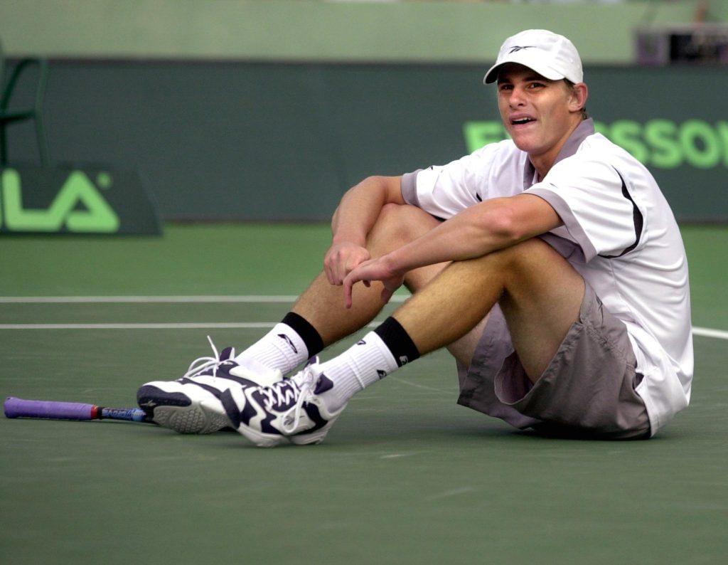 Andy Roddick of the US sits on the stadium court a