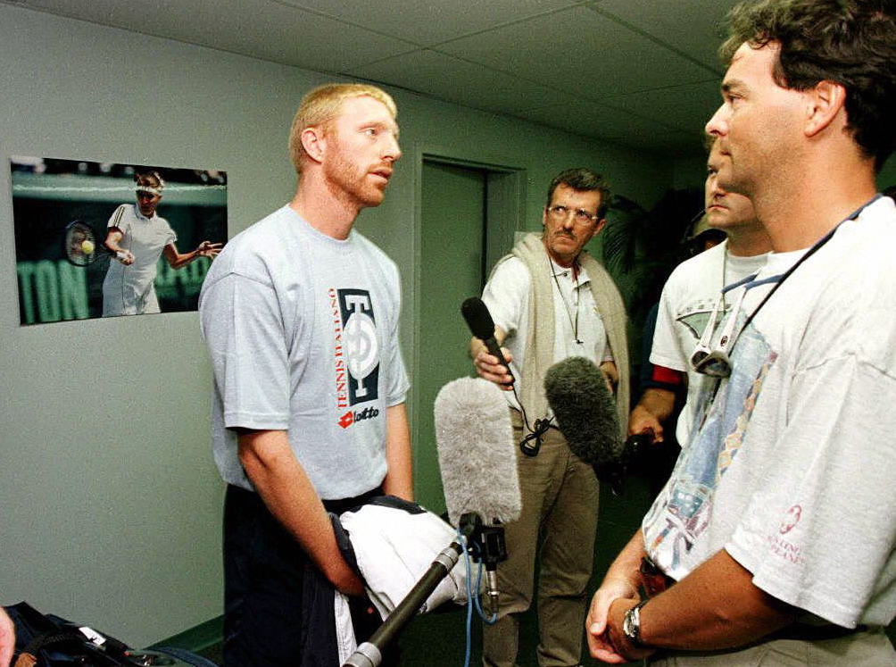 Germany's Boris Becker speaks with the German medi
