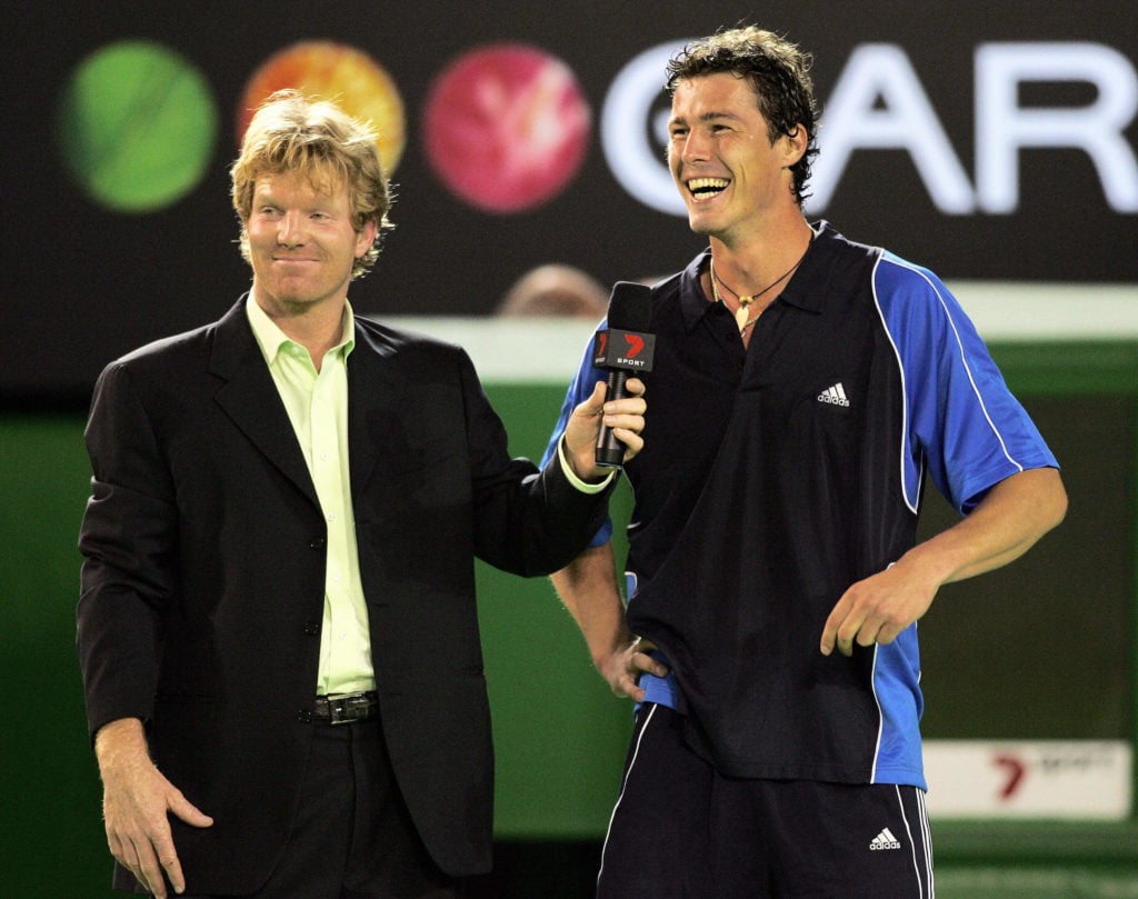 Marat Safin (R) of Russia enjoys a laugh