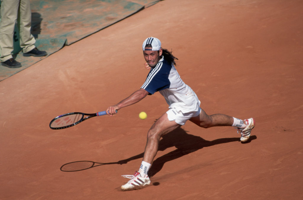 Tennis Player Rios Swinging at Ball