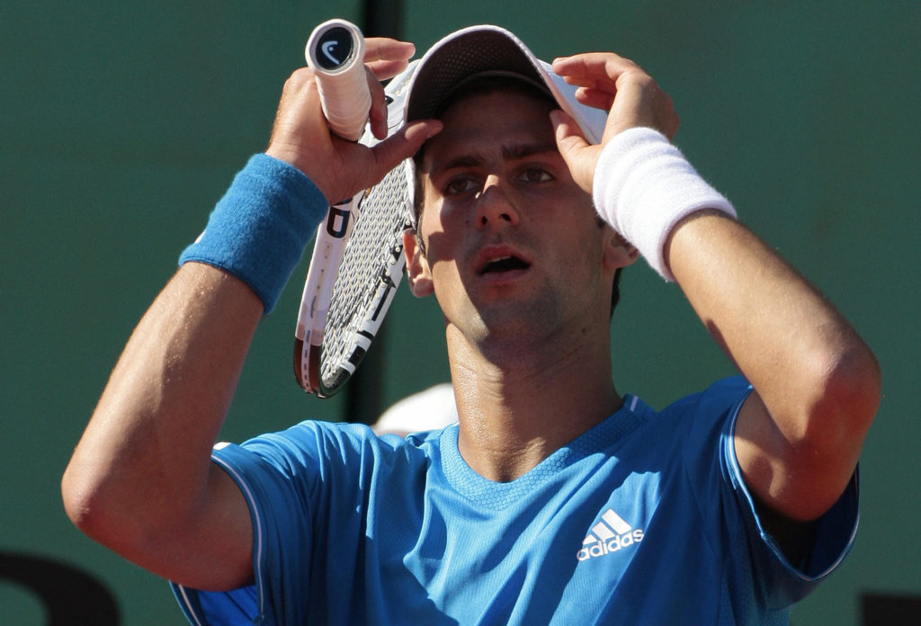 Serbian player Novak Djokovic reacts to