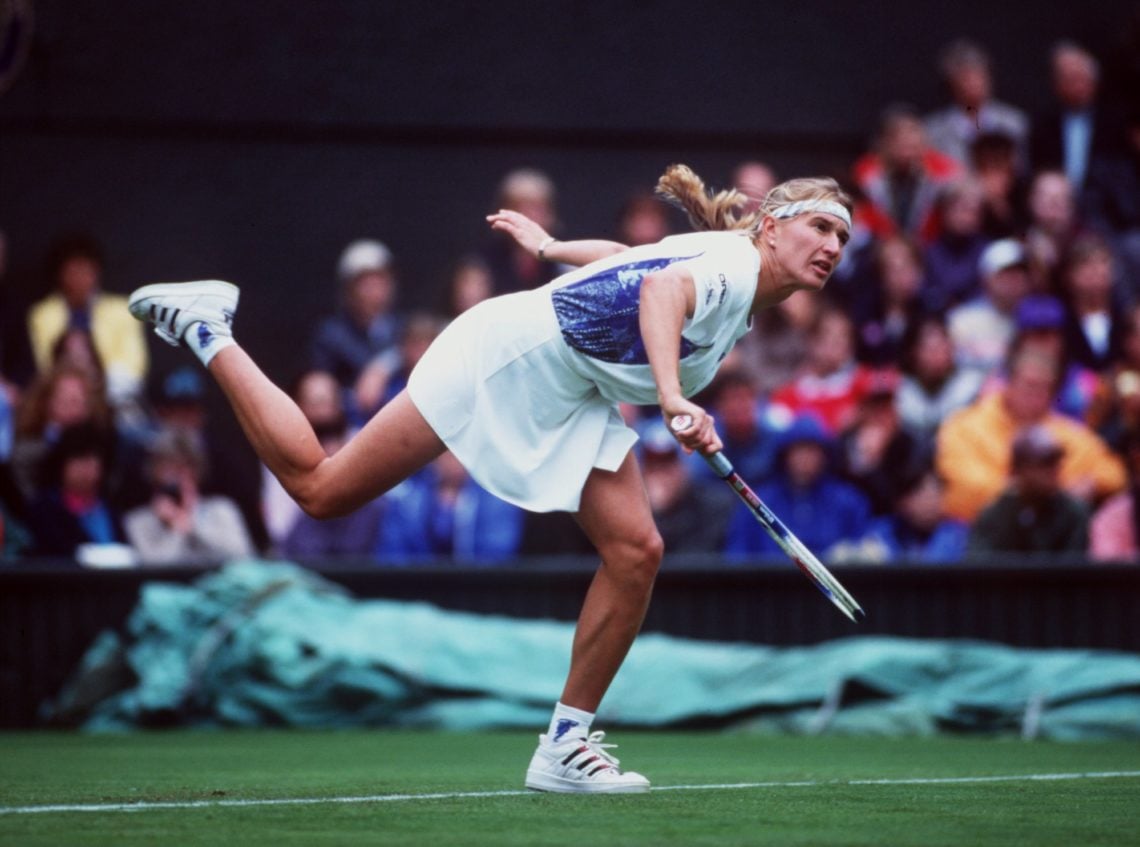 21 JUN 1994:  STEFFI GRAF OF GERMANY FOLLOWS THROUGH AFTER SERVING AGAINST LORI MCNEILL OF THE USA DURING THE FIRST DAY OF THE 1994 WIMBLEDON LAWN ...