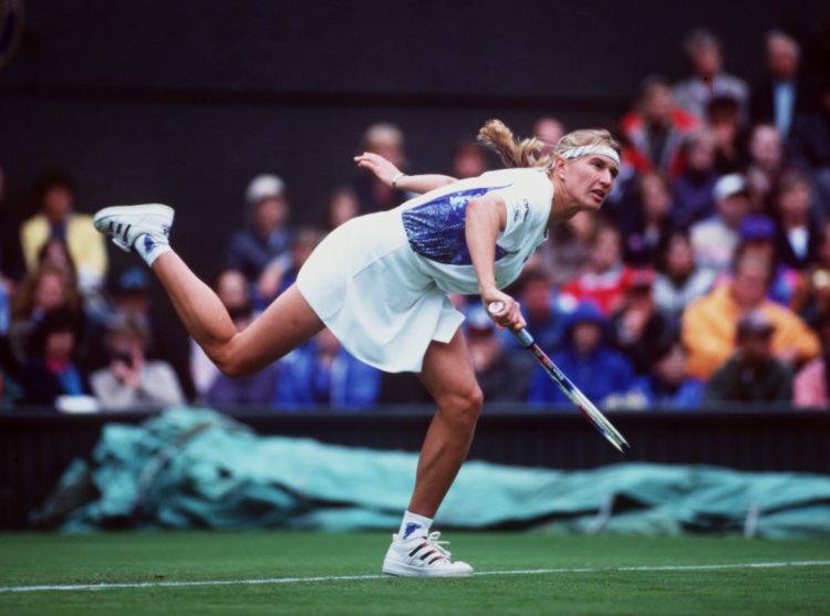 21 JUN 1994:  STEFFI GRAF OF GERMANY FOLLOWS THROUGH AFTER SERVING AGAINST LORI MCNEILL OF THE USA DURING THE FIRST DAY OF THE 1994 WIMBLEDON LAWN ...