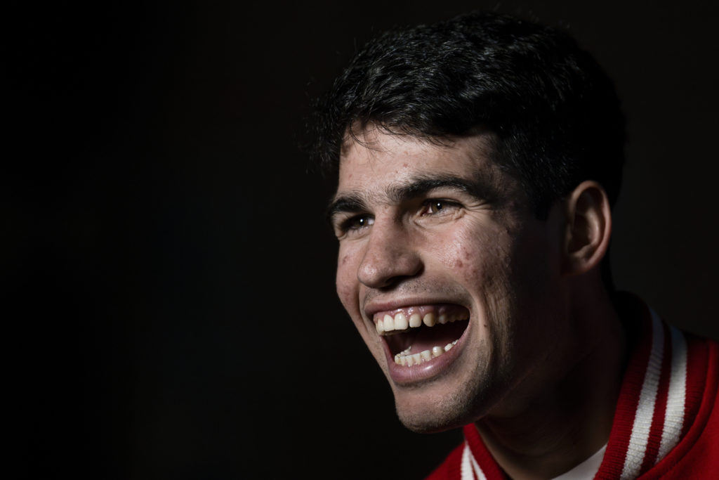 Carlos Alcaraz of Spain laughs during the Blue Carpet of the