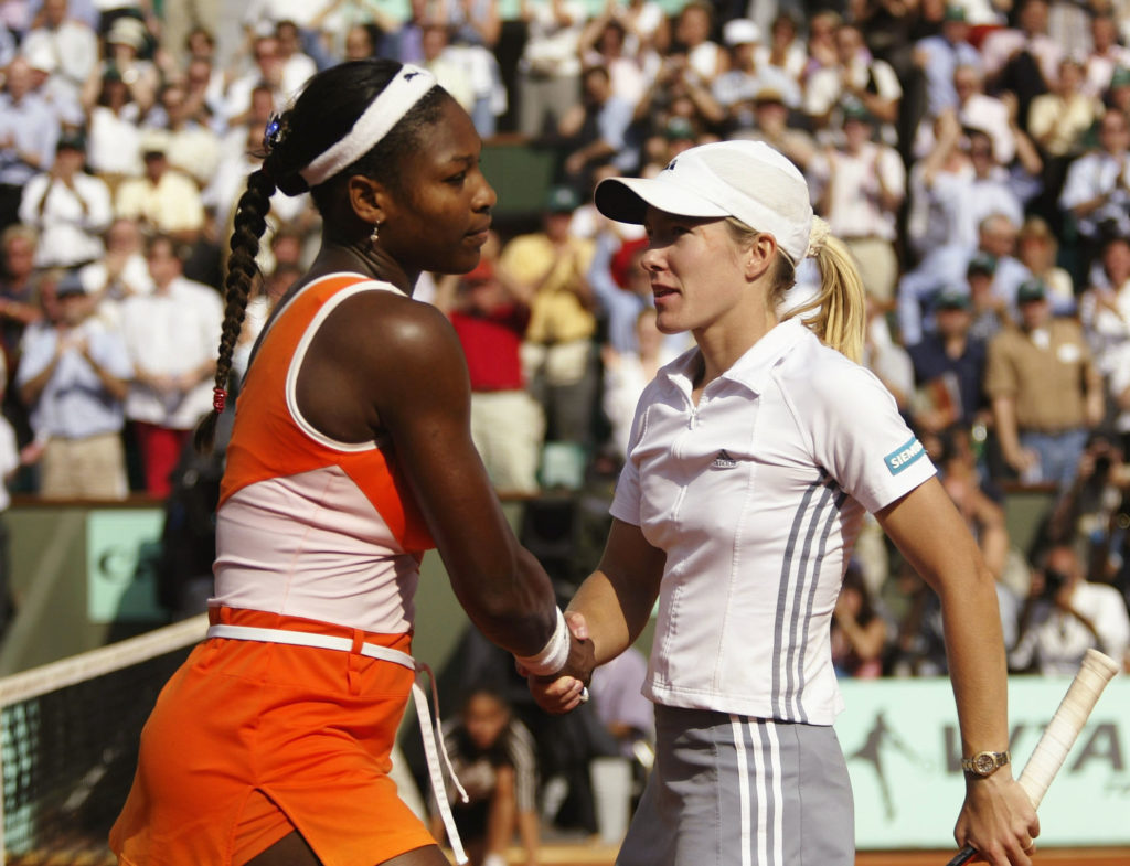 Serena Williams and Justine Henin-Hardenne shake hands