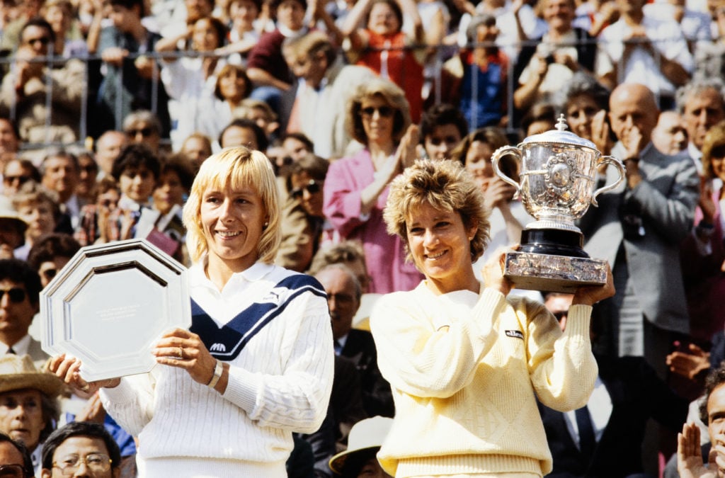 Martina Navratilova and Chris Evert pose with their titles at the 1985 French Open