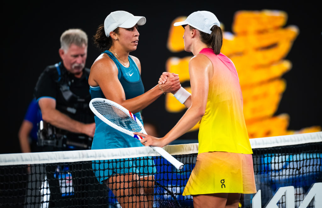 Madison Keys and Iga Swiatek shake hands.