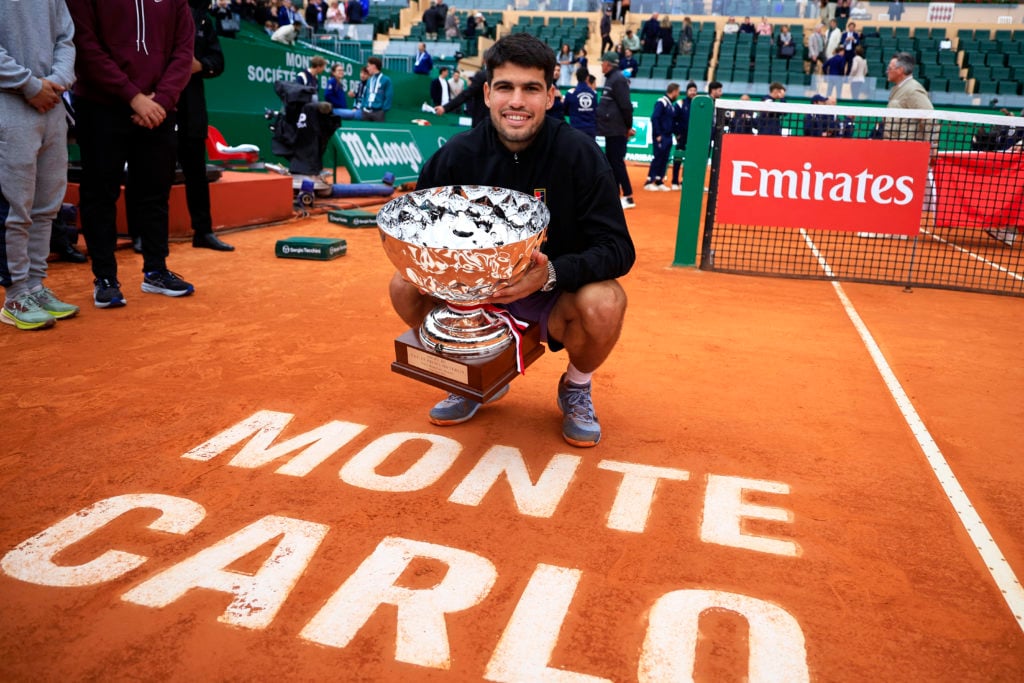 Carlos Alcaraz celebrates with the Monte-Carlo Masters title after beating Lorenzo Musetti in the 2025 final