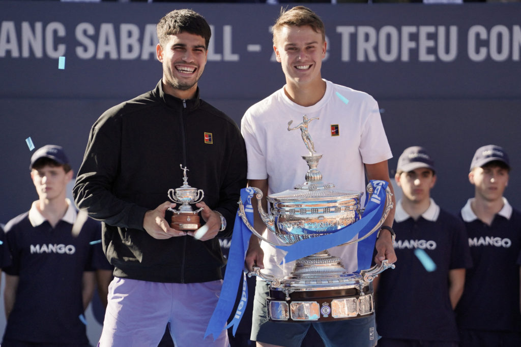Carlos Alcaraz and Holger Rune celebrate with their trophies after the 2025 Barcelona Open final