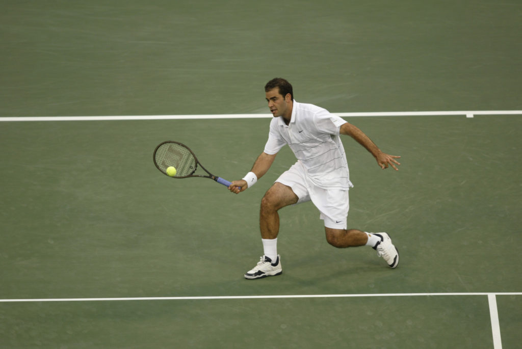 Pete Sampras returns a shot