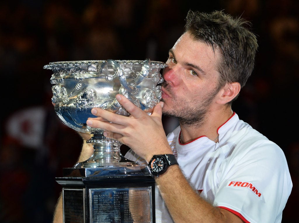 Stan Wawrinka kisses the trophy after beating Rafael Nadal in the 2014 Australian Open final