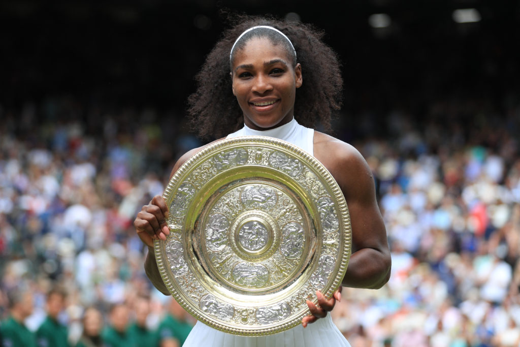 Serena Williams poses with the Wimbledon title in 2016.