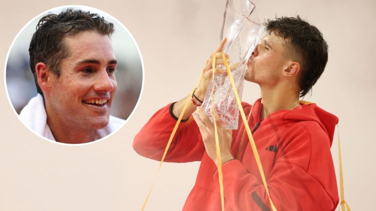 Jakub Mensik of the Czech Republic poses with the championship trophy after defeating Novak Djokovic of Serbia during the men's singles final on th...