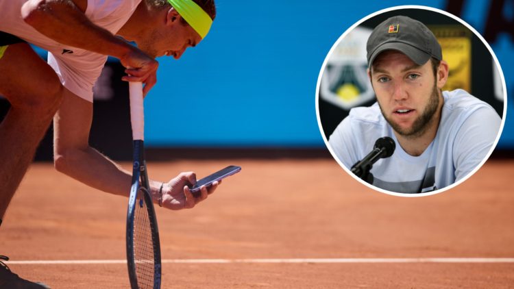 Alexander Zverev of Germany protest a referee decision taking a picture with the phone to the spot on the pitch on his match against Alejandro Davi...